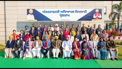 Punjab chief minister Bhagwant Mann with the first batch of government school principals who will be going to Singapore for the training seminar from February 6 to 10. (HT Photo)