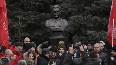 Stalingrad Anniversary: People take photos in front of the bust of Soviet leader Josef Stalin. (AP)