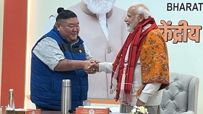 Nagaland Minister Temjen Imna Along shaking hands with PM Modi. (Twitter/@AlongImna) Nagaland Minister Temjen Imna Along shaking hands with PM Modi. (Twitter/@AlongImna)