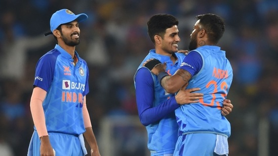 India's Shubman Gill (C) and teammate Hardik Pandya (R) celebrate India's win at the end of the third Twenty20 international cricket match between India and New Zealand at the Narendra Modi stadium in Ahmedabad on February 1, 2023. (Photo by Punit PARANJPE / AFP) / ----IMAGE RESTRICTED TO EDITORIAL USE - STRICTLY NO COMMERCIAL USE-----(AFP) India's Shubman Gill (C) and teammate Hardik Pandya (R) celebrate India's win at the end of the third Twenty20 international cricket match between India and New Zealand at the Narendra Modi stadium in Ahmedabad on February 1, 2023. (Photo by Punit PARANJPE / AFP) / ----IMAGE RESTRICTED TO EDITORIAL USE - STRICTLY NO COMMERCIAL USE-----(AFP)