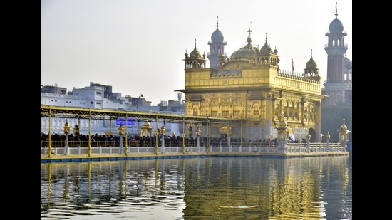 Devotees paying obeisance at the Golden Temple in Amritsar. Devotees paying obeisance at the Golden Temple in Amritsar.