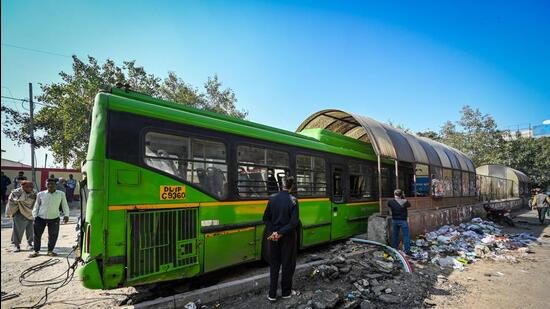 Eyewitnesses told police that the DTC bus first hit a Maruti Brezza car and then climbed the pavement before entering the subway. (Sanchit Khanna/HT Photo)