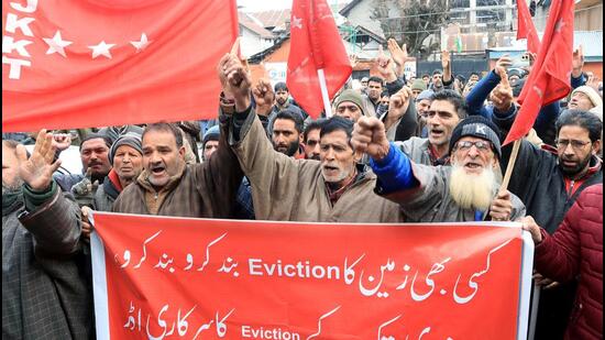 Jammu and Kashmir Kisan Tehreek (JKKT) supporters stage a protest against the administration's land eviction drive across valley, in Srinagar on Thursday. (ANI) Jammu and Kashmir Kisan Tehreek (JKKT) supporters stage a protest against the administration's land eviction drive across valley, in Srinagar on Thursday. (ANI)