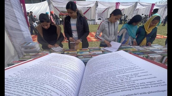 Students during the book fair at PAU in Ludhiana on Thursday. (Gurpreet Singh/HT Photo)