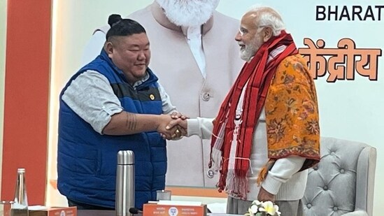 Nagaland Minister Temjen Imna Along shaking hands with PM Modi.(Twitter/@AlongImna)