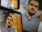 Gautam Adani, chairman of Adani Group, during a video speech on monitors in Mumbai, on Thursday,(Bloomberg) Gautam Adani, chairman of Adani Group, during a video speech on monitors in Mumbai, on Thursday,(Bloomberg)