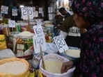 Pakistan Economic Crisis: A woman checks rice prices at a main wholesale market in Karachi. (AFP) Pakistan Economic Crisis: A woman checks rice prices at a main wholesale market in Karachi. (AFP)