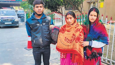 The family of 34-year-old Vikas Thakur who is undergoing treatment at the All India Institute of Medical Sciences. He was beaten up with a cricket bat by a school teacher. (HT Photo) The family of 34-year-old Vikas Thakur who is undergoing treatment at the All India Institute of Medical Sciences. He was beaten up with a cricket bat by a school teacher. (HT Photo)