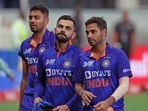 Virat Kohli, Bhuvneshwar Kumar and Avesh Khan Virat Kohli, Bhuvneshwar Kumar and Avesh Khan
