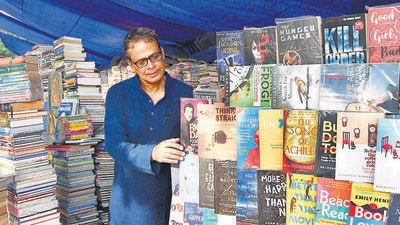 Mumbai, India - January 31, 2023: Eminent author, writer, novelist and journalist Jerry Pinto walks through the roadside book stalls, at Fort, in Mumbai, India, on Tuesday, January 31, 2023. (Photo by Bhushan Koyande/HT Photo) (HT PHOTO) Mumbai, India - January 31, 2023: Eminent author, writer, novelist and journalist Jerry Pinto walks through the roadside book stalls, at Fort, in Mumbai, India, on Tuesday, January 31, 2023. (Photo by Bhushan Koyande/HT Photo) (HT PHOTO)