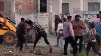 Police personnel and JCB driver came under attack from Jhitarkhedi villagers in Ujjain during an anti-encroachment drive (ANI Photo)
