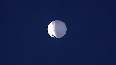 The huge, high-altitude Chinese balloon sailed across the U.S. on Friday, drawing severe Pentagon accusations of spying and sending  excited or alarmed Americans outside with binoculars. (AP)