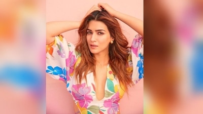 Her linen dress is from the shelves of clothing label Sonam Parmar Jhawar while styling is done by sukriti Grivar. Her dress features a deep V neckline, flared hemline and multi coloured flowers all over her white dress. (Instagram/@Kritisanon) Her linen dress is from the shelves of clothing label Sonam Parmar Jhawar while styling is done by sukriti Grivar. Her dress features a deep V neckline, flared hemline and multi coloured flowers all over her white dress. (Instagram/@Kritisanon)