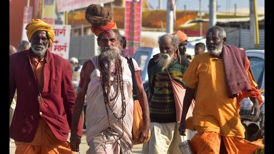 Pilgrims and saints arriving on the eve of the bathing festival of Maghi Purnima at Magh Mela area on the banks of Sangam in Prayagraj, on Saturday. (Anil Kumar Maurya/HT)