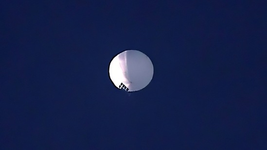  The huge, high-altitude Chinese balloon sailed across the U.S. on Friday, drawing severe Pentagon accusations of spying and sending excited or alarmed Americans outside with binoculars.(AP)