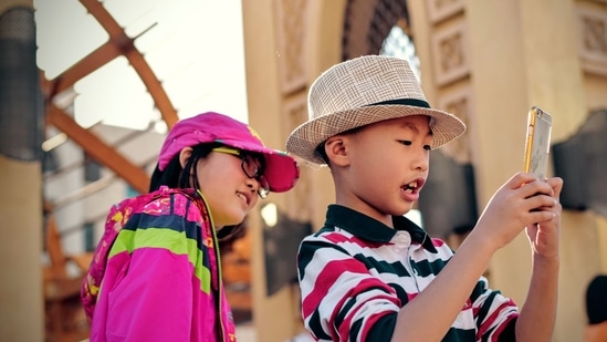 Smartphones usage among children can be detrimental to their sound growth.(Photo by Tim Gouw on Unsplash)