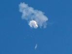 The suspected Chinese spy balloon drifts to the ocean after being shot down off the coast in Surfside Beach, South Carolina, US, on Saturday. (REUTERS)(HT_PRINT) The suspected Chinese spy balloon drifts to the ocean after being shot down off the coast in Surfside Beach, South Carolina, US, on Saturday. (REUTERS)(HT_PRINT)