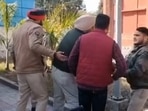 Screengrab of the alleged incident showing the ASI being taken away by other officials.