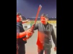 A group of men seen drinking, dancing and brandishing guns on a Ghaziabad road. (Twitter) A group of men seen drinking, dancing and brandishing guns on a Ghaziabad road. (Twitter)