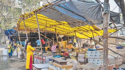 In July last year, the market building was demolished amid heavy rains on the grounds that it was an ‘unsafe’ structure — in the C-1 category of dilapidated buildings. Since then, the vendors have been forced out onto into an open area next to the demolition site. As a sign of protest, the vendors have erected some temporary structures at their own expense and have shunned the use of a common shed provided by the BMC as an alternative. (Satish Bate/HT PHOTO) In July last year, the market building was demolished amid heavy rains on the grounds that it was an ‘unsafe’ structure — in the C-1 category of dilapidated buildings. Since then, the vendors have been forced out onto into an open area next to the demolition site. As a sign of protest, the vendors have erected some temporary structures at their own expense and have shunned the use of a common shed provided by the BMC as an alternative. (Satish Bate/HT PHOTO)