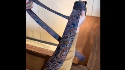 The image, taken from the viral Twitter video, shows the tie knot hack. (Screengrab)