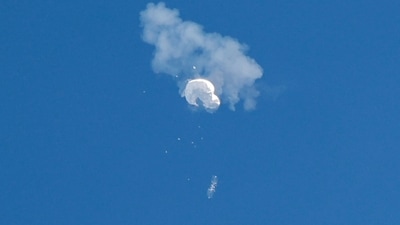 The suspected Chinese spy balloon drifts to the ocean after being shot down off the coast in Surfside Beach, South Carolina. (REUTERS)