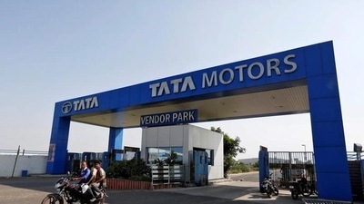Men ride a motorbike past a Tata Motors car plant at Sanand, in Gujarat. (Reuters) Men ride a motorbike past a Tata Motors car plant at Sanand, in Gujarat. (Reuters)