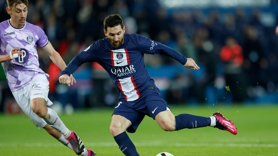PSG's Lionel Messi, right, kicks the ball next to Toulouse's Anthony Rouault during the French League One soccer match between Paris Saint-Germain and Toulouse, at the Parc des Princes, in Paris, France, Saturday, Feb. 4, 2023. AP/PTI(AP02_05_2023_000005A)(AP)
