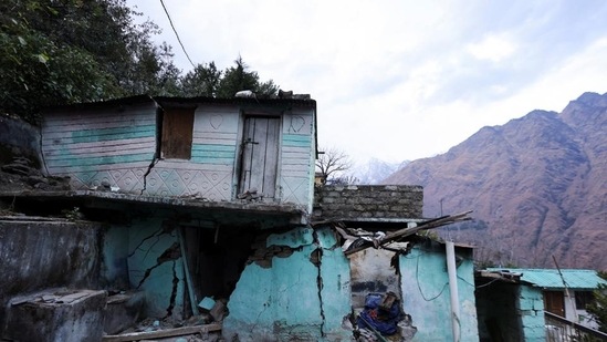 Cracks are seen on the walls of a residential house in Joshimath on Friday. (Reuters) Cracks are seen on the walls of a residential house in Joshimath on Friday. (Reuters)