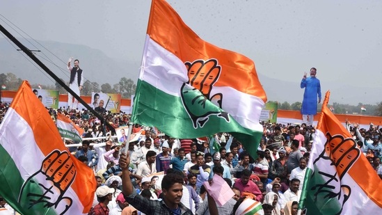 Congress supporters with Congress flags ahead of a rally. (File)