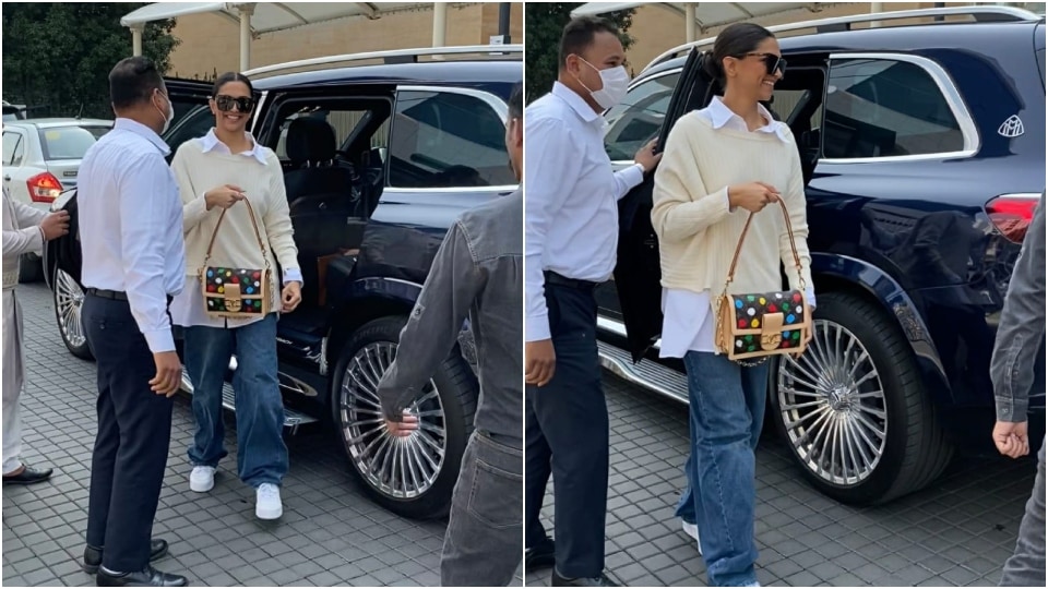 Deepika Padukone styled her white camisole + khaki pants with a roomy  Burberry tote