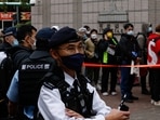 Hong Kong National Security Trial: Police stand guard outside the West Kowloon Magistrates' Courts building.