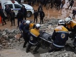 Members of the Syrian civil defence, known as the White Helmets transport a casualty pulled from the rubble following an earthquake in the town of Zardana in the countryside of the northwestern Syrian Idlib province, early on Monday.(AFP) Members of the Syrian civil defence, known as the White Helmets transport a casualty pulled from the rubble following an earthquake in the town of Zardana in the countryside of the northwestern Syrian Idlib province, early on Monday.(AFP)