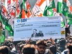Indian Youth Congress activists protest over the impact on LIC and SBI investors due to Adani row, at Jantar Mantar in New Delhi on Monday (PTI) Indian Youth Congress activists protest over the impact on LIC and SBI investors due to Adani row, at Jantar Mantar in New Delhi on Monday (PTI)