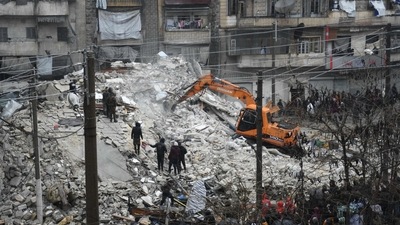 People watch as rescue teams look for survivors under the rubble of a collapsed building after the earthquake in the regime-controlled northern Syrian city of Aleppo, on February 6. The region sits on top of major fault lines and is frequently shaken by earthquakes. Some 18,000 were killed in a similarly powerful earthquake that hit northwest Turkey in 1999. (AFP) People watch as rescue teams look for survivors under the rubble of a collapsed building after the earthquake in the regime-controlled northern Syrian city of Aleppo, on February 6. The region sits on top of major fault lines and is frequently shaken by earthquakes. Some 18,000 were killed in a similarly powerful earthquake that hit northwest Turkey in 1999. (AFP)