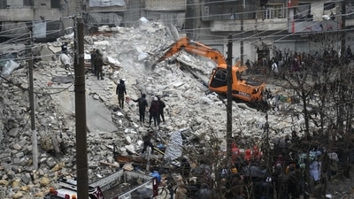 People watch as rescue teams look for survivors under the rubble of a collapsed building after the earthquake in the regime-controlled northern Syrian city of Aleppo, on February 6. The region sits on top of major fault lines and is frequently shaken by earthquakes. Some 18,000 were killed in a similarly powerful earthquake that hit northwest Turkey in 1999. (AFP) People watch as rescue teams look for survivors under the rubble of a collapsed building after the earthquake in the regime-controlled northern Syrian city of Aleppo, on February 6. The region sits on top of major fault lines and is frequently shaken by earthquakes. Some 18,000 were killed in a similarly powerful earthquake that hit northwest Turkey in 1999. (AFP)