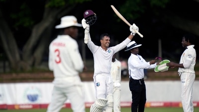 West Indies batsman Tagenarine Chanderpaul celebrates after scoring 100 runs (AP)