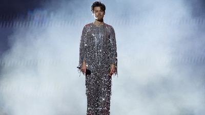 During his performance at the Grammys, Harry Styles changed into a shimmering silver jumpsuit decked in tassels and sequin embellishments.&nbsp; (REUTERS)