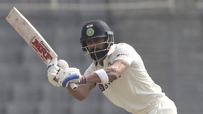 Virat Kohli, left, bats during the second day of the second cricket test match between Bangladesh and India (AP) Virat Kohli, left, bats during the second day of the second cricket test match between Bangladesh and India (AP)