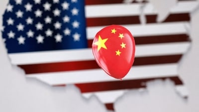 Chinese Spy Balloon: A printed balloon with Chinese flag is placed on a US flag in the shape of US map outline, in this illustration. (Reuters)