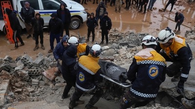 Members of the Syrian civil defence, known as the White Helmets transport a casualty pulled from the rubble following an earthquake in the town of Zardana in the countryside of the northwestern Syrian Idlib province, early on Monday. (AFP) Members of the Syrian civil defence, known as the White Helmets transport a casualty pulled from the rubble following an earthquake in the town of Zardana in the countryside of the northwestern Syrian Idlib province, early on Monday. (AFP)