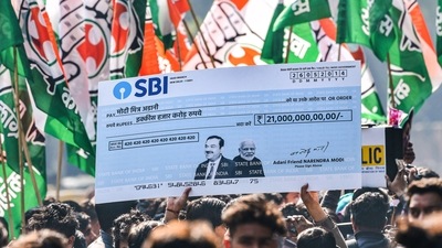 Indian Youth Congress activists protest over the impact on LIC and SBI investors due to Adani row, at Jantar Mantar in New Delhi on Monday (PTI) Indian Youth Congress activists protest over the impact on LIC and SBI investors due to Adani row, at Jantar Mantar in New Delhi on Monday (PTI)