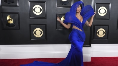 Cardi B added an Indian touch to the Grammys red carpet as she wore an ensemble from Gaurav Gupta's couture label. The gown featured the Indian designer's signature architectural additions, cut-outs on the waist, a figure-hugging silhouette, a floor-sweeping long train, and a plunging neckline. Diamond jewels, high heels, a sleek hairdo, and on-fleek glam rounded it off. (AP) Cardi B added an Indian touch to the Grammys red carpet as she wore an ensemble from Gaurav Gupta's couture label. The gown featured the Indian designer's signature architectural additions, cut-outs on the waist, a figure-hugging silhouette, a floor-sweeping long train, and a plunging neckline. Diamond jewels, high heels, a sleek hairdo, and on-fleek glam rounded it off. (AP)