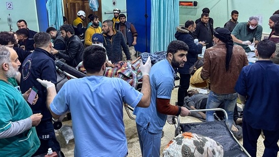 Victims were rushed to the emergency ward of the Bab al-Hawa hospital following the earthquake, in the rebel-held northern countryside of Syria's Idlib province on the border with Turkey, on February 6. Strained health facilities and hospitals were quickly filled with the wounded, rescue workers said. Others had to be emptied, including a maternity hospital, according to the SAMS medical organization, AP reported. (Aaref Watad / AFP)
