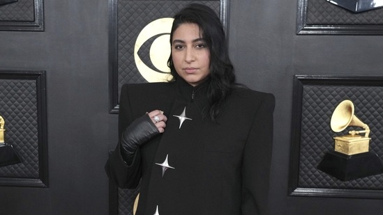 Pakistani singer, composer Arooj Aftab arrived at the 65th annual Grammy Awards in a sleek black blazer decked with star embellishments, stylish skinny-fit pants, high-heeled boots, faux-leather gloves and side-parted sleek hairdo.&nbsp;(Jordan Strauss/Invision/AP)