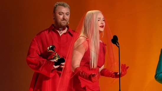Kim Petras and Sam Smith accept the award for best pop duo/group performance for Unholy at the 65th Grammy Awards. (Chris Pizzello/Invision/AP)