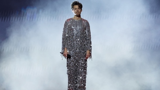 During his performance at the Grammys, Harry Styles changed into a shimmering silver jumpsuit decked in tassels and sequin embellishments.&nbsp;(REUTERS)