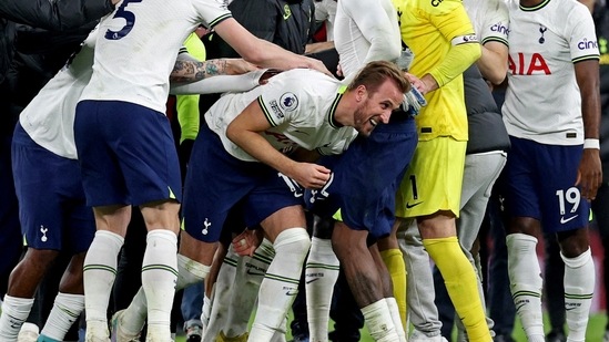 Tottenham Hotspur players celebrate with Harry Kane after the match (REUTERS)