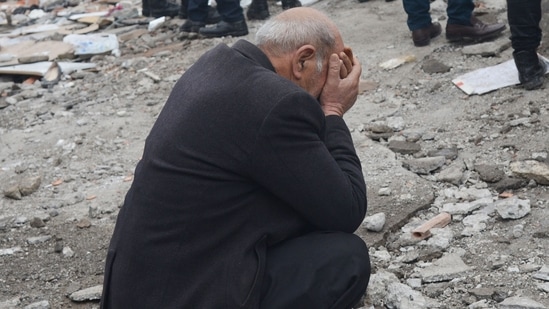  A man reacts as people search for survivors in Diyarbakir after a 7.8-magnitude earthquake struck the country's south-east on Monday. (AFP)