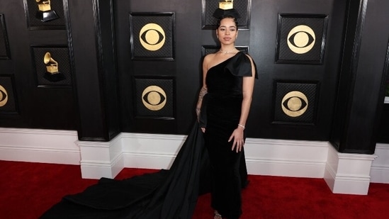 Ella Mai for this year's red carpet, chose to go for a classic black gown with off-shoulder and ruffle details on the other sleeve. The gown also featured an elaborate black satin train. In minimal makeup and a clean bun, Ella aced the look.&nbsp;(Reuters)